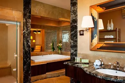 a bathroom with a tub and a large mirror at The Westin Dubai Mina Seyahi Beach Resort and Waterpark in Dubai