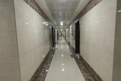 a corridor in a building with a long hallway at Comfortable Apartments and Studios for Rent in Dubai in Dubai