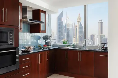 a kitchen with a large window with a city view at Jumeirah Living World Trade Centre Dubai in Dubai