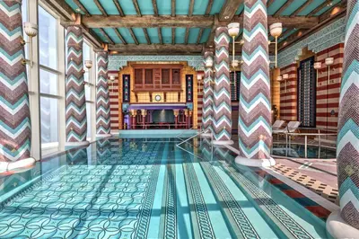 a pool in the middle of a room with a tile floor at Jumeirah Burj Al Arab Dubai in Dubai