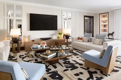 a living room filled with furniture and a flat screen tv at Jumeirah Dar Al Masyaf Dubai in Dubai