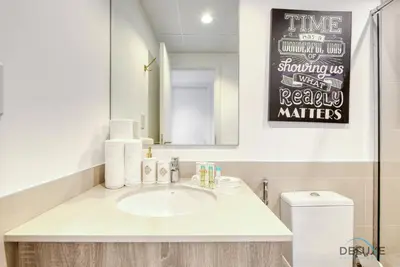 a bathroom with a sink and a mirror at Charismatic 1BR at UNA Town Square Dubailand by Deluxe Holiday Homes in Dubai