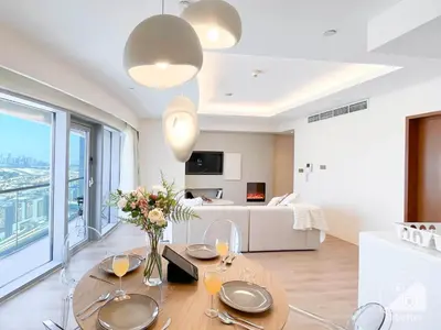 a living room with a dining table with a view at Dubai Mall 1Bedroom Balcony in Dubai