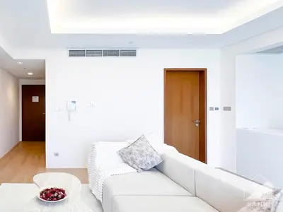 a white living room with a white couch at Dubai Mall 1Bedroom Balcony in Dubai