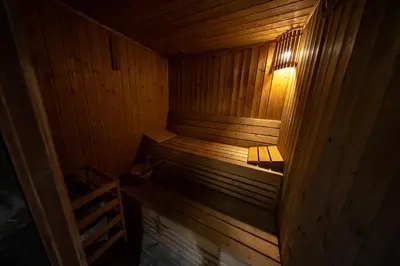 an empty wooden sauna with a light in it at City Stay Grand Hotel Apartments - Al Barsha in Dubai