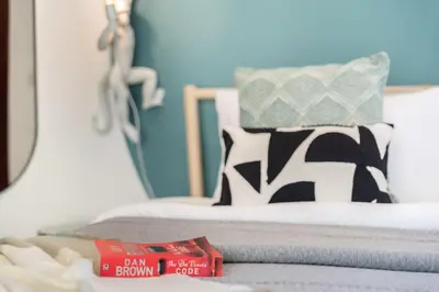 a bedroom with a bed with a pillow and a table at The Smart Concierge - Bahar 6 in Dubai