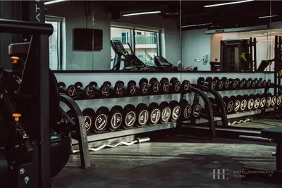 a row of empty chairs in a gym at HE Hotel Apartments in Dubai