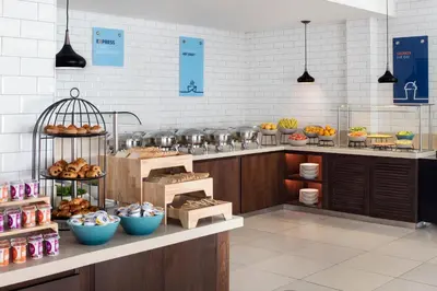 a bakery with a bunch of different types of food at Holiday Inn Express Dubai, Jumeirah by IHG in Dubai