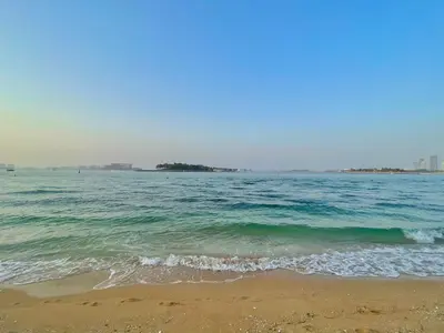 a view of the ocean from the beach at Luxury - Beachfront - Spacious Shoreline residences - 5 star private beach resort in Dubai