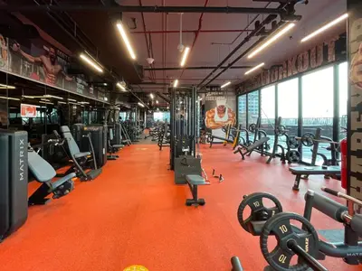 a gym with a lot of treadmills and machines at GuestReady - Gray Cloud Retreat - MBL Cluster in Dubai