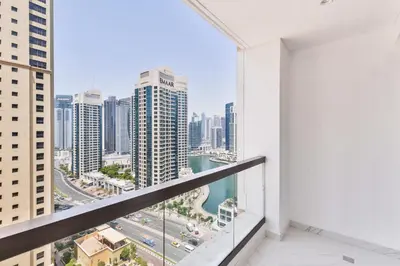 an apartment balcony with a view of the city at Waterfront Luxury 3BR with maids room in JBR, Dubai in Dubai