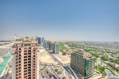 an aerial view of a city with tall buildings at Homely 1BR at The Matrix Dubai Sports City by Deluxe Holiday Homes in Dubai