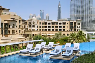 a row of lounge chairs sitting on top of a building at Address Downtown in Dubai