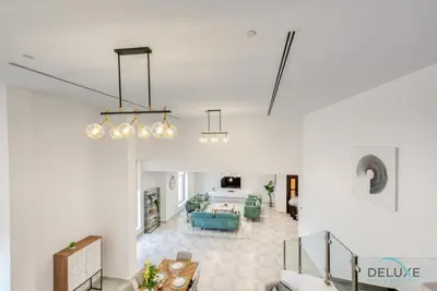 a living room with a couch and a table at Outstanding 3BR at Sadaf 7 JBR by Deluxe Holiday Homes in Dubai