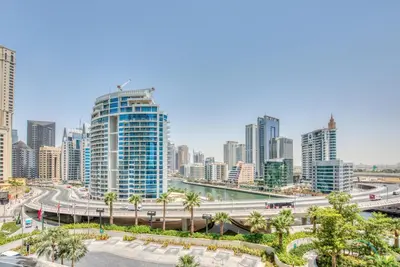a city skyline with tall buildings and a highway at Classy 1BR at The Address Residences in JBR by Deluxe Holiday Homes in Dubai