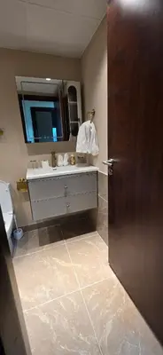 a bathroom with a sink and a mirror at Cozy 2 BR apt Golf Tower Greens, stunning Golf views in Dubai