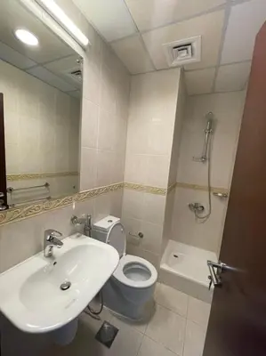 a bathroom with a sink and a toilet and a shower at Luxury Kings Palace Private Room with Shared Kitchen Next To Barasti Beach in Dubai