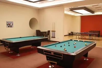 a billiard room with two pool tables in it at Luxury Kings Palace Private Room with Shared Kitchen Next To Barasti Beach in Dubai