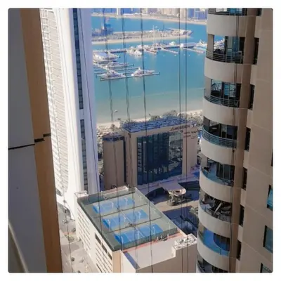 a view of a city from a tall building at Luxury Kings Palace Private Room with Shared Kitchen Next To Barasti Beach in Dubai