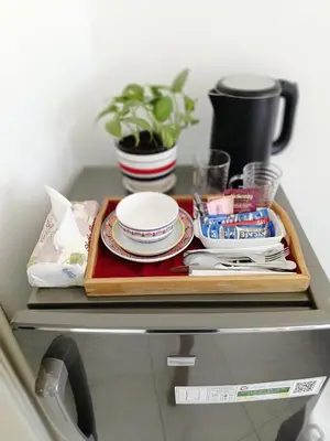 a tray of plates and dishes on a shelf in a refrigerator at Jumeirah Beach Villa in Dubai