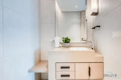 a bathroom with a sink and a mirror at Posh 1BR at The Address Residences in JBR by Deluxe Holiday Homes in Dubai