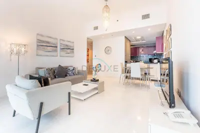 a living room with a couch and a table at Sea Views 1BR in the Heart of Dubai Marina by Deluxe Holiday Homes in Dubai
