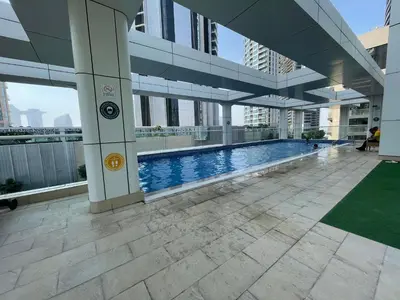 a swimming pool in the middle of a building at Peaceful Oasis 3BR+kids, 7 min walk to Dubai Mall in Dubai
