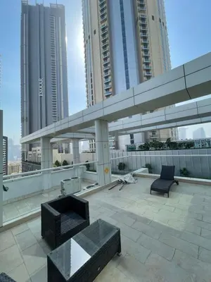 a view of a rooftop of a building with buildings at Peaceful Oasis 3BR+kids, 7 min walk to Dubai Mall in Dubai