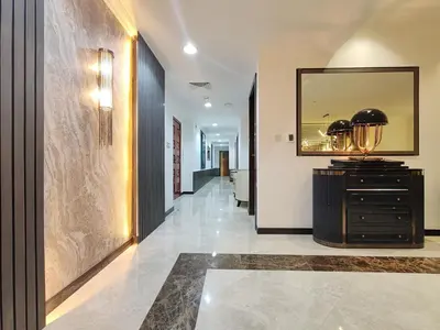 a hallway with a mirror and a dresser in a room at Elan Murjan Rimal Suites, Sea in 3 min walk! 6 Bedrooms & Hall, Massive Layout in Dubai