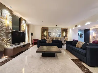 a living room with couches and a flat screen tv at Elan Murjan Rimal Suites, Sea in 3 min walk! 6 Bedrooms & Hall, Massive Layout in Dubai
