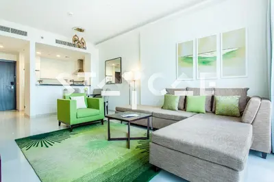 a living room with a couch and a table at Staycae Holiday Homes - Celestia in Dubai