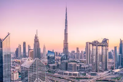 a city skyline with the burj khalifa at Rove City Walk in Dubai