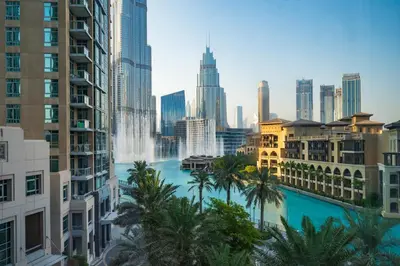 a view of a city skyline with a fountain at Burj Residence by Radiance Vacation Stays in Dubai