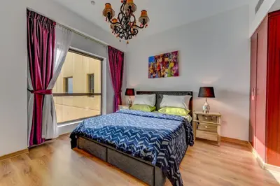 a bedroom with a bed and a window at VIP Castles JBR Rimal 3 Suite 1 Bedroom in Dubai