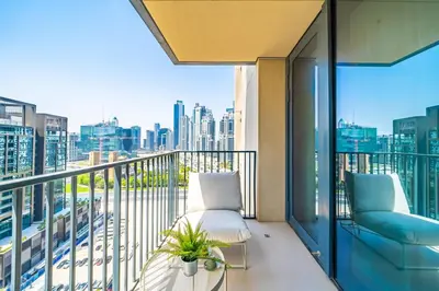 a balcony with a view of a city skyline at Incredible Views From This Classy Apt With Terrace in Dubai