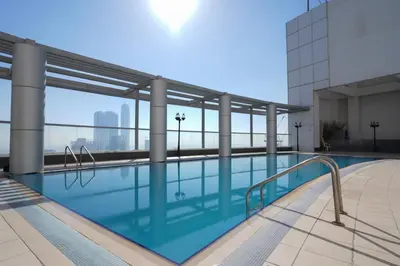 a swimming pool on the floor of a building at RH- Prime Location, Spacious 2BR, walk to Dubai Mall in Dubai