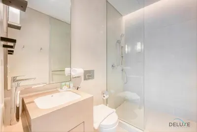 a bathroom with a sink and a toilet and a shower at Pristine 2BR with Assistants Room at The Address Residences in JBR by Deluxe Holiday Homes in Dubai
