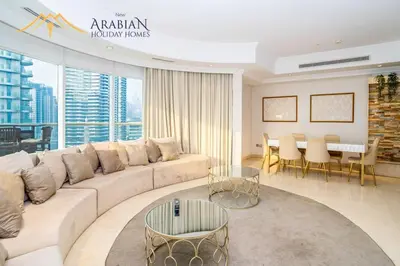 a living room with a couch and a table at New Arabian Trident Waterfront 3 BR plus maid in Dubai