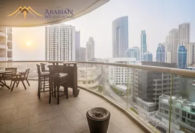 a balcony with a view of a city skyline at New Arabian Trident Waterfront 3 BR plus maid in Dubai