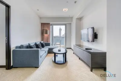 a living room with a couch and a tv at Pristine 1BR at The Address Residences Dubai Marina by Deluxe Holiday Homes in Dubai