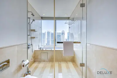 a bathroom with a shower with a view of the city at Pristine 1BR at The Address Residences Dubai Marina by Deluxe Holiday Homes in Dubai