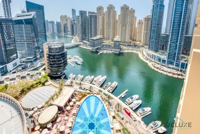a view of a river in a city with boats at Pristine 1BR at The Address Residences Dubai Marina by Deluxe Holiday Homes in Dubai