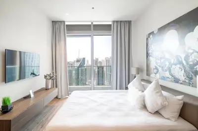 a bedroom with a large bed with a large window at Luton Vacation Homes - Marina View & Luxury 1BR - Jumeirah Living Marina Gate Tower 3 - 54AB49AB36AB in Dubai