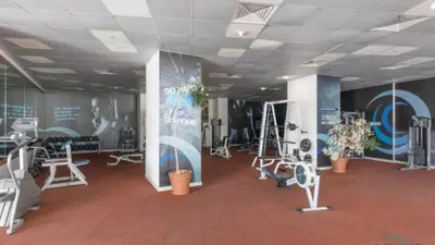 a gym with treadmills and exercise equipment in a building at WSuites - Big Terrace with Beautiful Marina View in Dubai