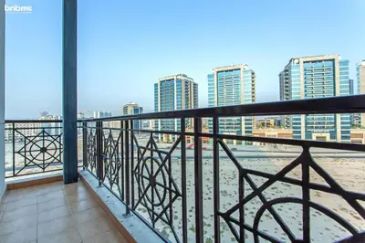 a balcony with a view of the ocean and buildings at bnbmehomes - La Fontana in Dubai