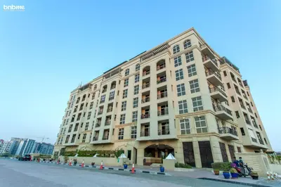 a large building on the side of a street at bnbmehomes - La Fontana in Dubai