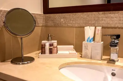 a bathroom counter with a sink and a mirror at FIRST CLASS 3BR with full BURJ KHALIFA and FOUNTAIN VIEW in Dubai