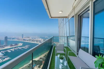 an apartment balcony with a view of the ocean at White Sage - Incredible Full Sea and Dubai Eye View in Marina in Dubai