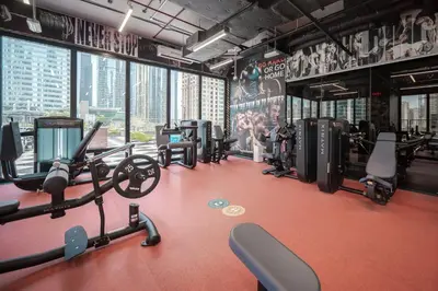 a gym with treadmills and cardio equipment in a building at Tranquil Retreat with Canal View 1BR MBL Residence - 29AB12 in Dubai