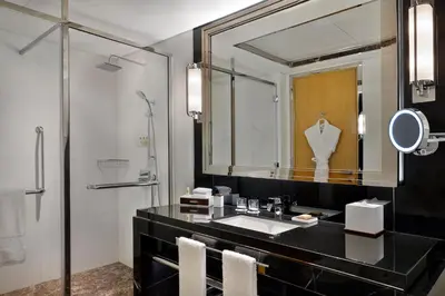 a bathroom with a sink and a mirror at Hilton Dubai Palm Jumeirah in Dubai